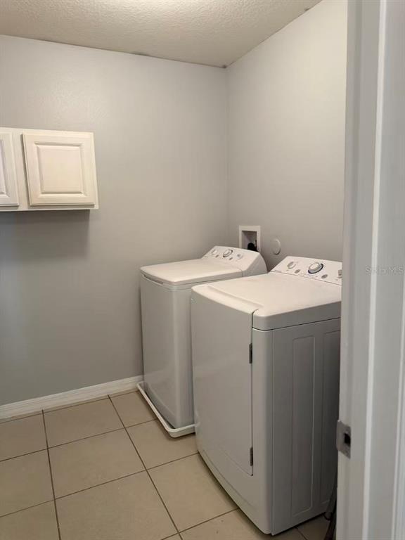 2114 Rockmart Loop Tavares, FL 32778 - Photo 14 of 18 a utility room with dryer and washer