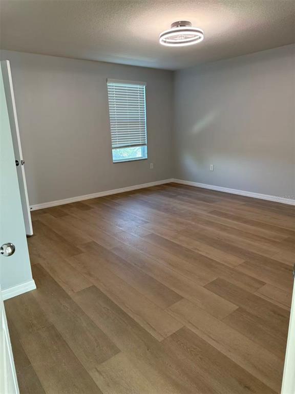 2114 Rockmart Loop Tavares, FL 32778 - Photo 10 of 18 an empty room with windows