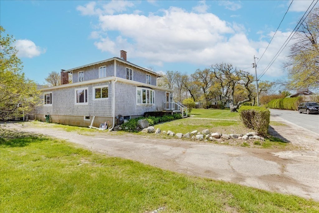 88 Marion Road Scituate, MA 02066 - Photo 26 of 41 a front view of a house with a yard