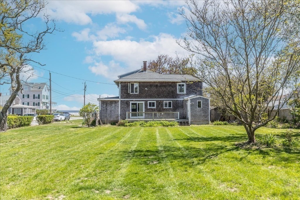88 Marion Road Scituate, MA 02066 - Photo 31 of 41 a view of a house with a big yard and large trees