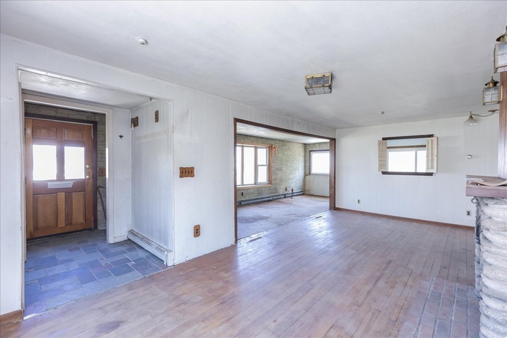 88 Marion Road Scituate, MA 02066 - Photo 39 of 41 a view of a livingroom with wooden floor and windows