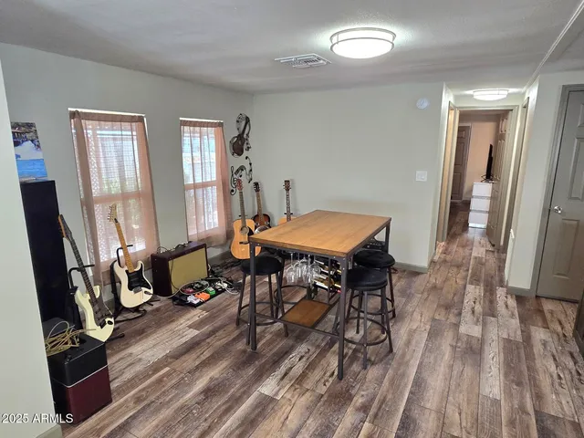 a view of a room with furniture window and wooden floor