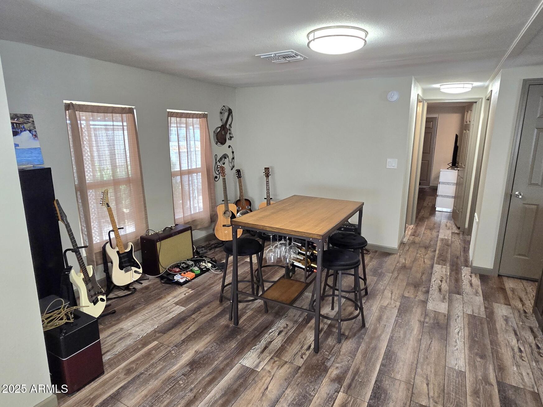 2900 West Superstition Boulevard, Unit 46 Apache Junction, AZ 85120 - Photo 12 of 26 a view of a room with furniture window and wooden floor