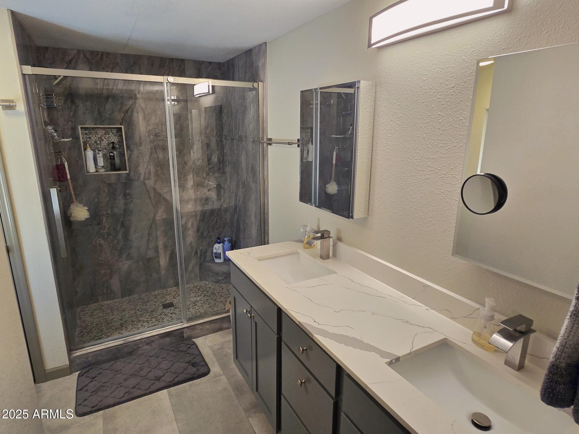 2900 West Superstition Boulevard, Unit 46 Apache Junction, AZ 85120 - Photo 19 of 26 a bathroom with a sink and a mirror