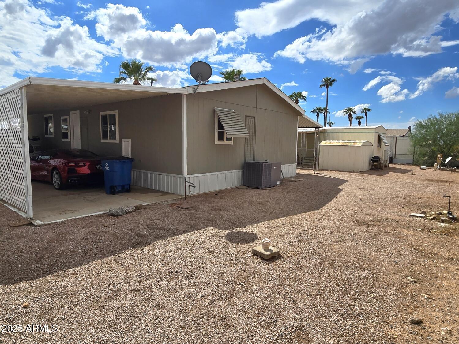 2900 West Superstition Boulevard, Unit 46 Apache Junction, AZ 85120 - Photo 25 of 26 a view of a house with a snow in the yard