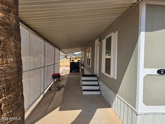 a view of balcony with wooden floor and stairs