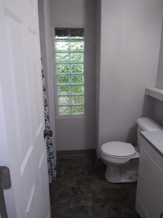 a white stove top oven sitting inside of a kitchen