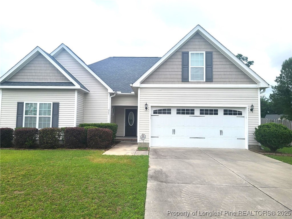 a view of house with a yard
