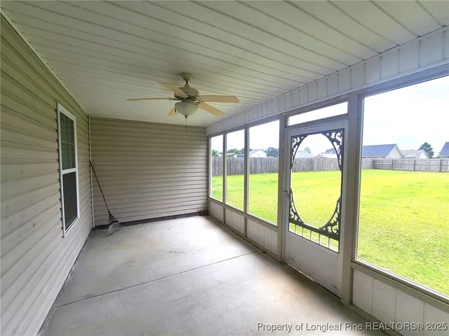 a view of an empty room with a large window