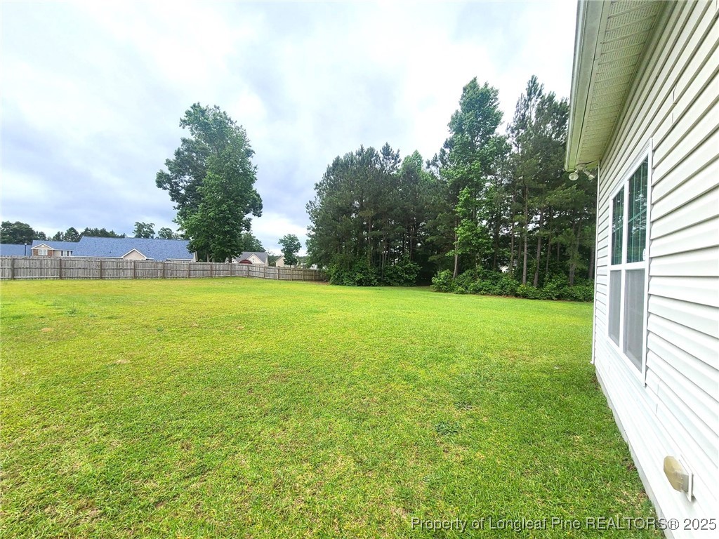 265 Carolina Oaks Circle Linden, NC 28356 - Photo 16 of 31 a view of yard with swimming pool and outdoor seating