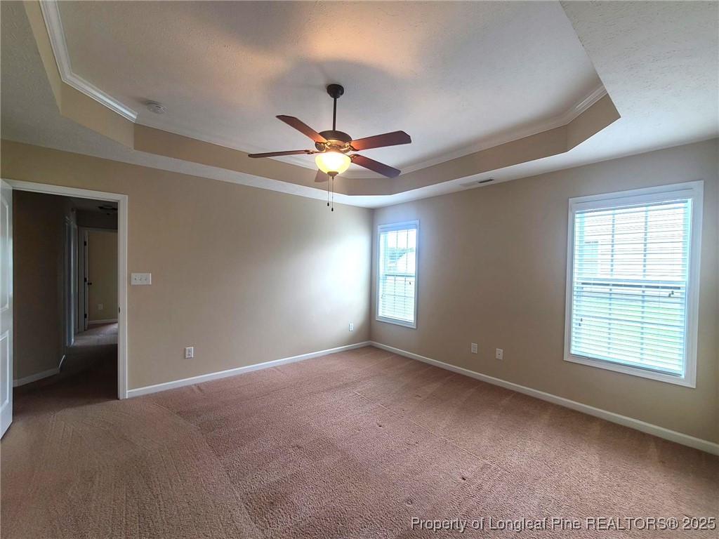 265 Carolina Oaks Circle Linden, NC 28356 - Photo 17 of 31 a view of a livingroom with a ceiling fan and window