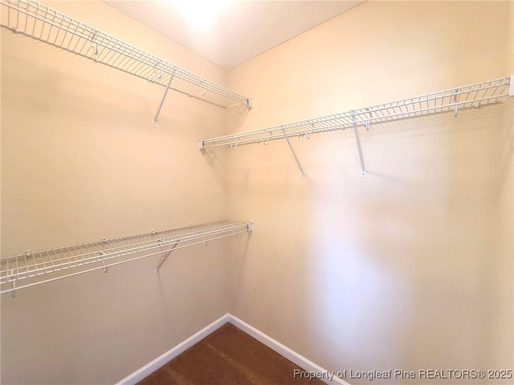 265 Carolina Oaks Circle Linden, NC 28356 - Photo 20 of 31 a view of a room with racks on the wall