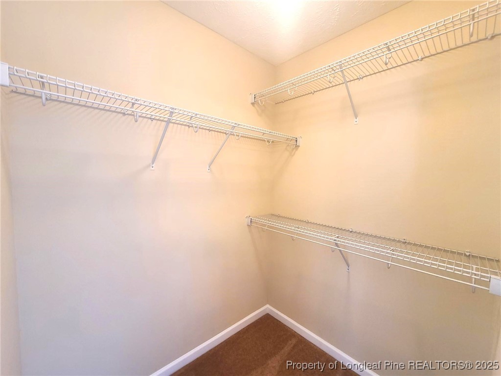265 Carolina Oaks Circle Linden, NC 28356 - Photo 23 of 31 a view of a room with racks on the wall