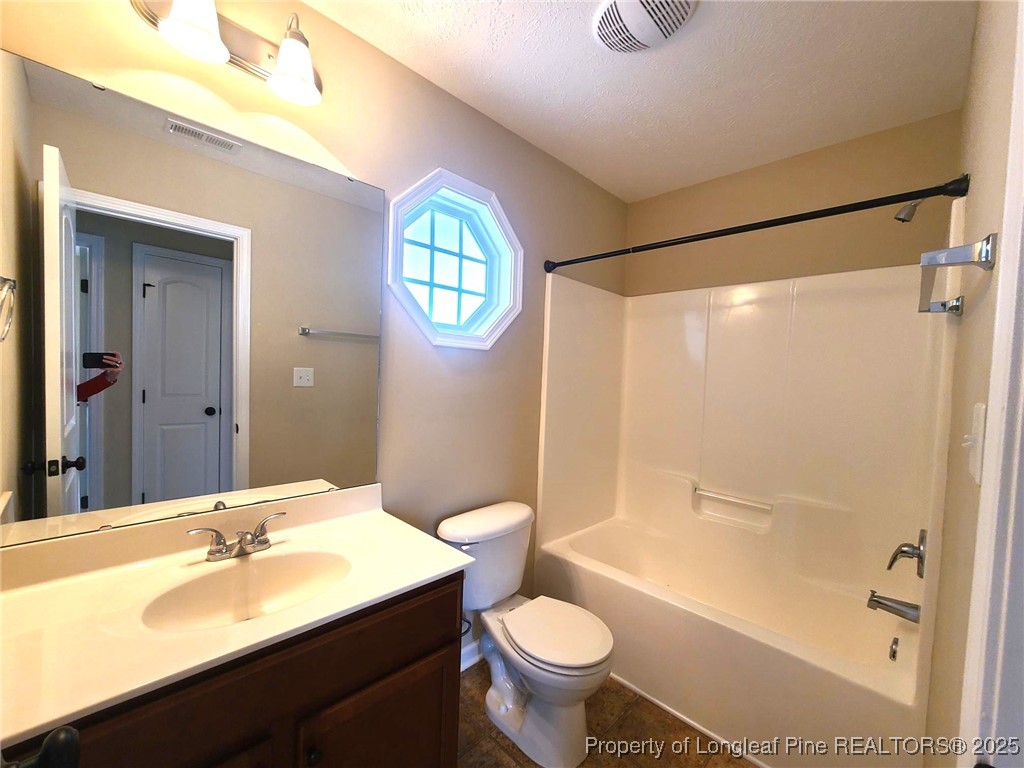 265 Carolina Oaks Circle Linden, NC 28356 - Photo 27 of 31 a bathroom with a sink toilet and shower