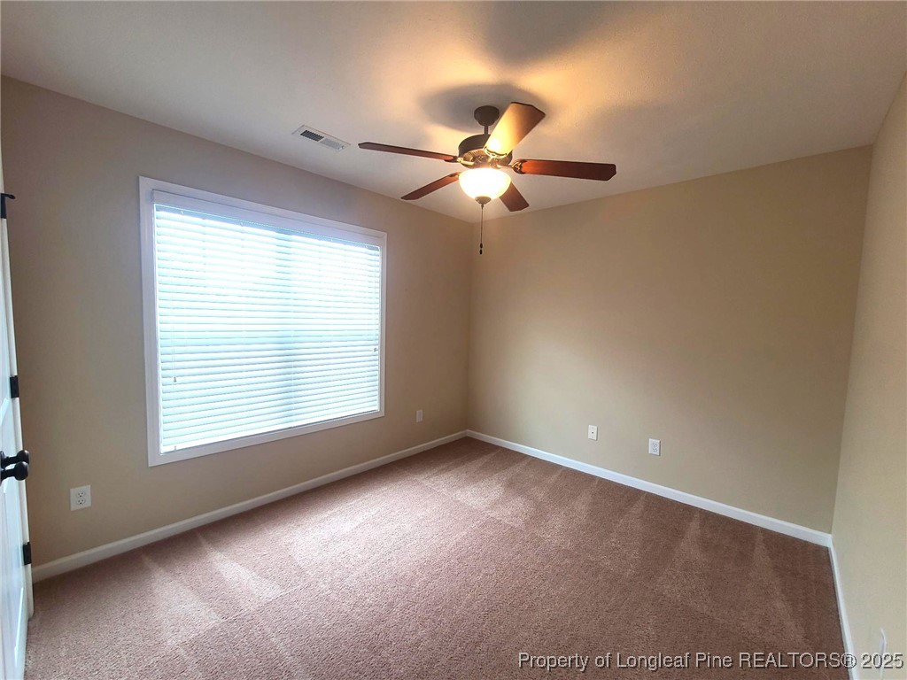 265 Carolina Oaks Circle Linden, NC 28356 - Photo 28 of 31 a view of an empty room with a window