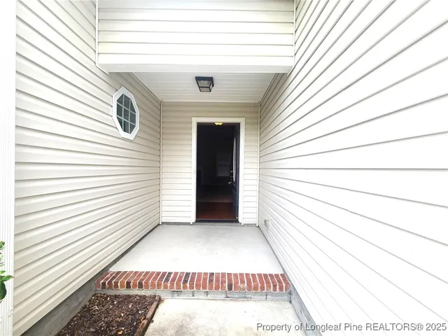 a view of a door and a window