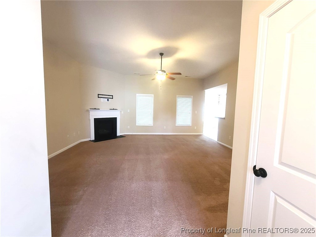 265 Carolina Oaks Circle Linden, NC 28356 - Photo 4 of 31 a view of empty room with a fireplace