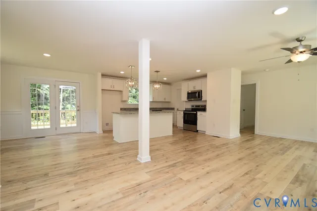 a view of kitchen with wooden floor and window