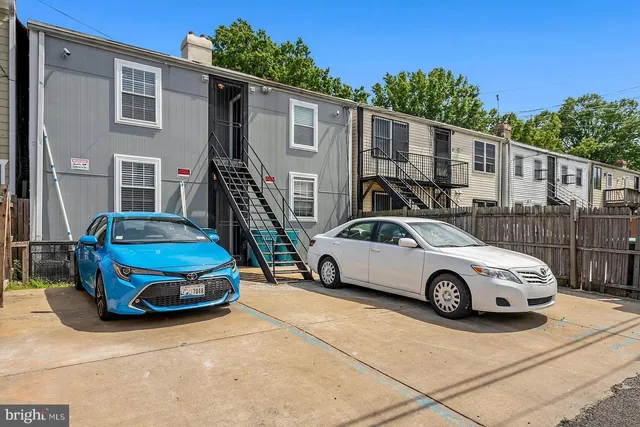 a car parked in front of a house