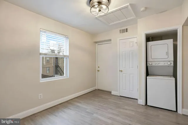 a view of a room that has a large window