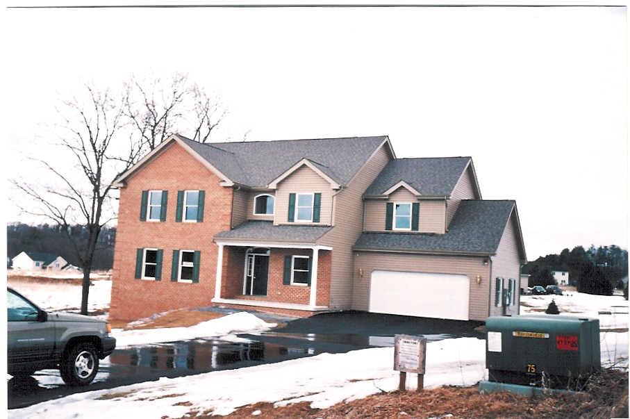 119 Bridle Road Stroudsburg, PA 18360 - Photo 1 of 2 a front view of a house with a yard