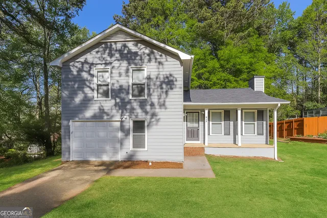 front view of a house with a yard