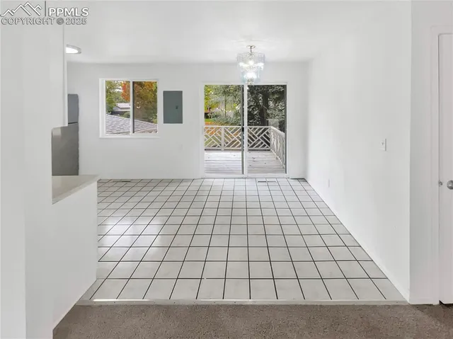 a view of an empty room with windows