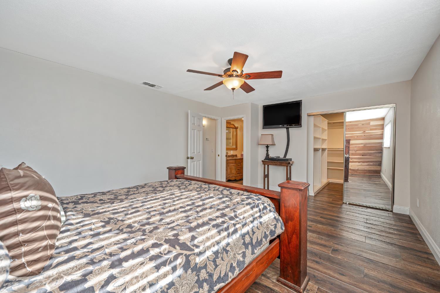 2700 Lassen Way Rocklin, CA 95677 - Photo 18 of 36 a bedroom with a bed and a chandelier