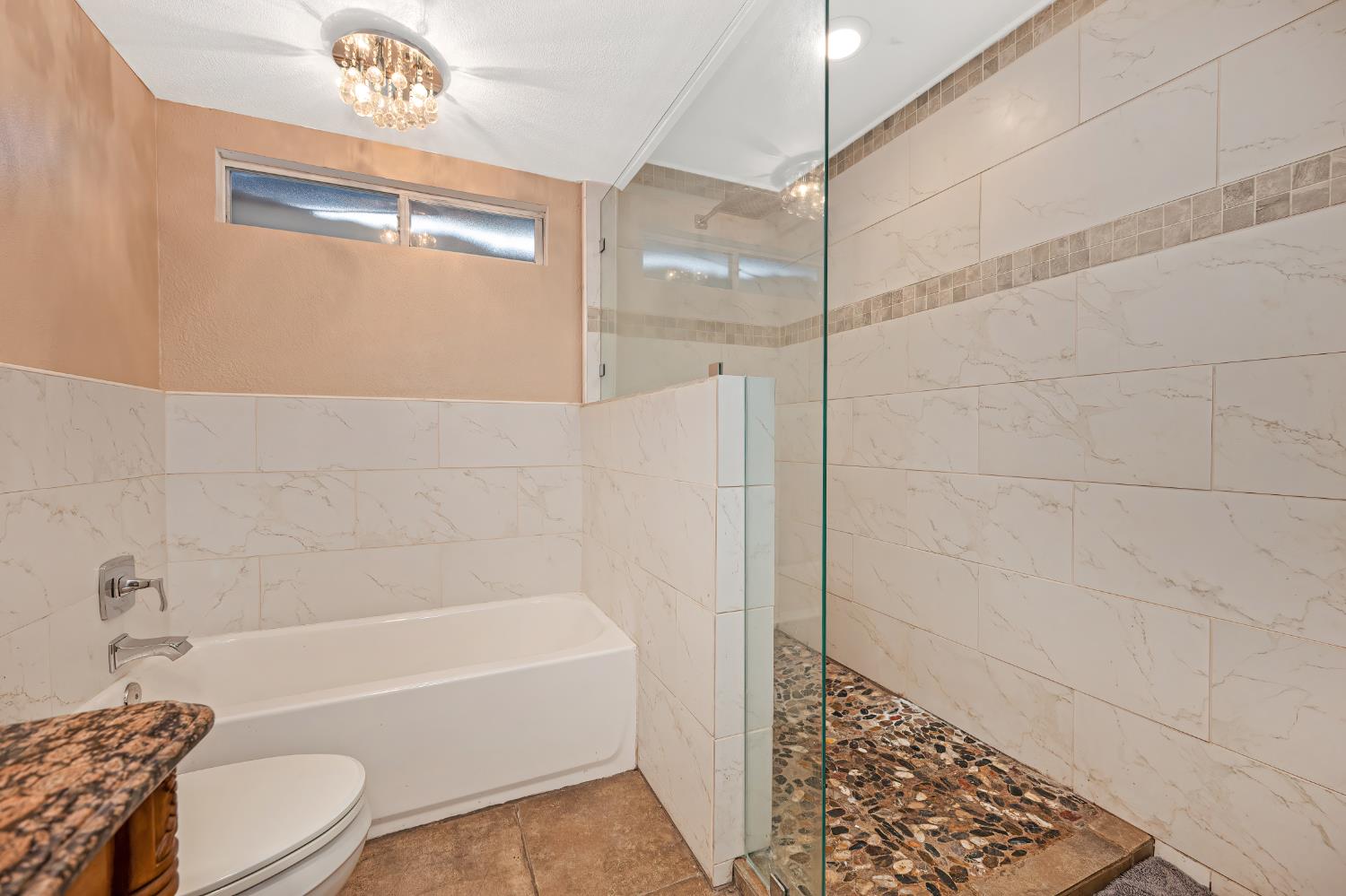2700 Lassen Way Rocklin, CA 95677 - Photo 21 of 36 a bathroom with a bathtub and a shower