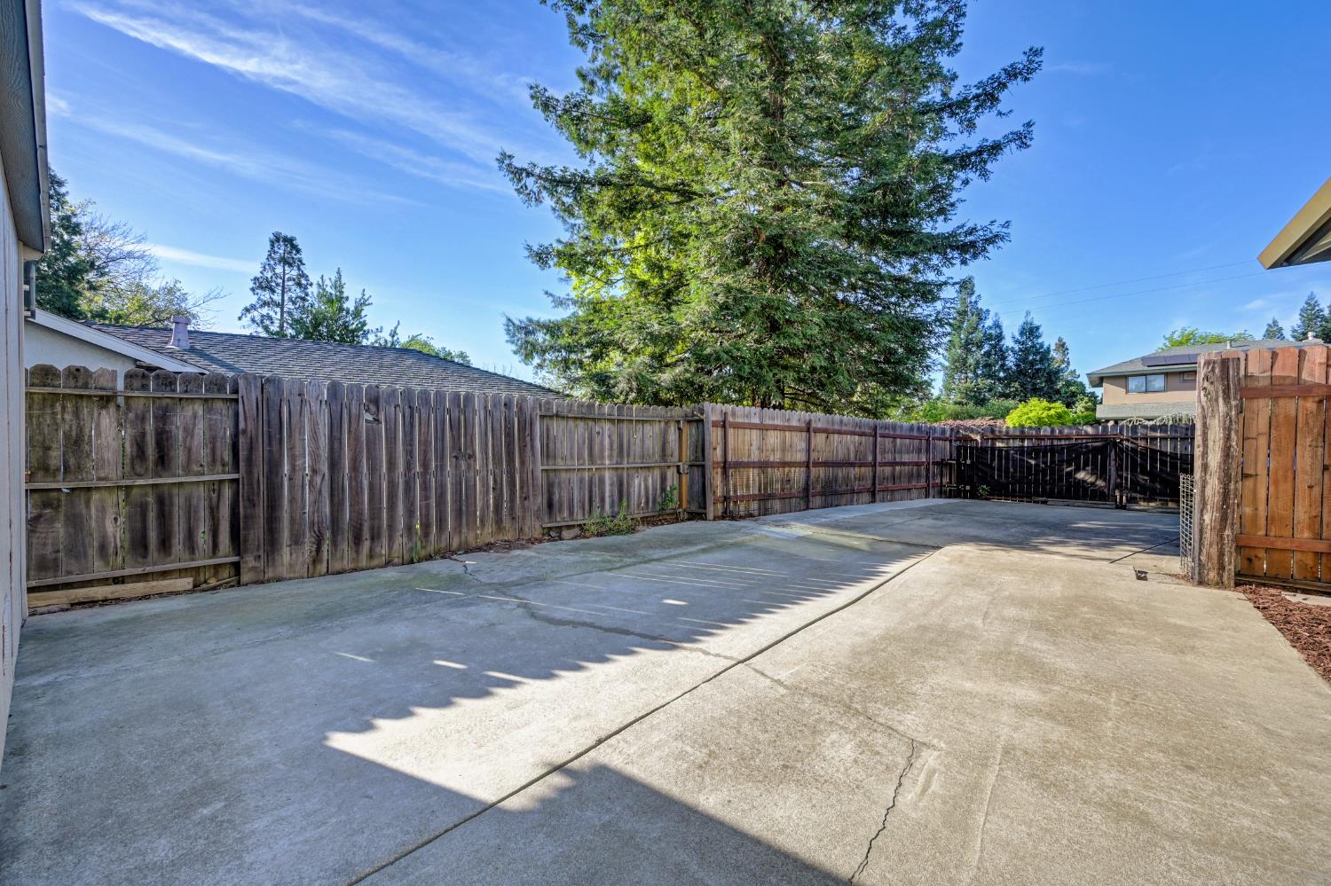 2700 Lassen Way Rocklin, CA 95677 - Photo 31 of 36 a view of backyard with wooden fence and trees