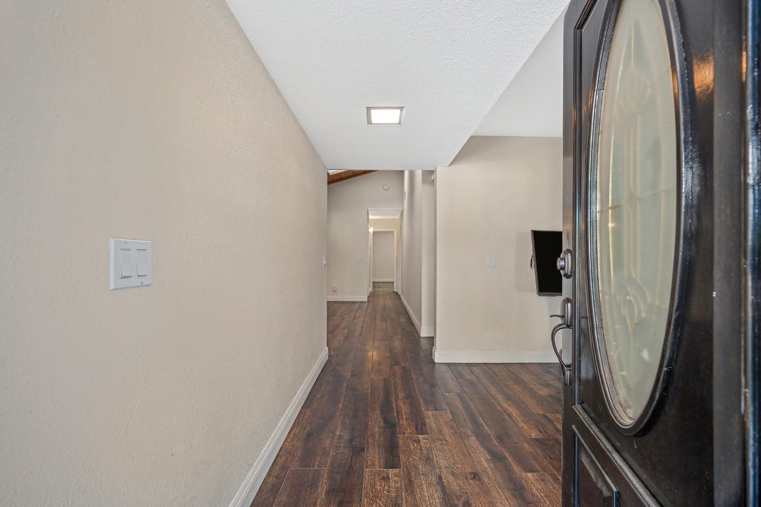 2700 Lassen Way Rocklin, CA 95677 - Photo 5 of 36 a view of a hallway with wooden floor and staircase