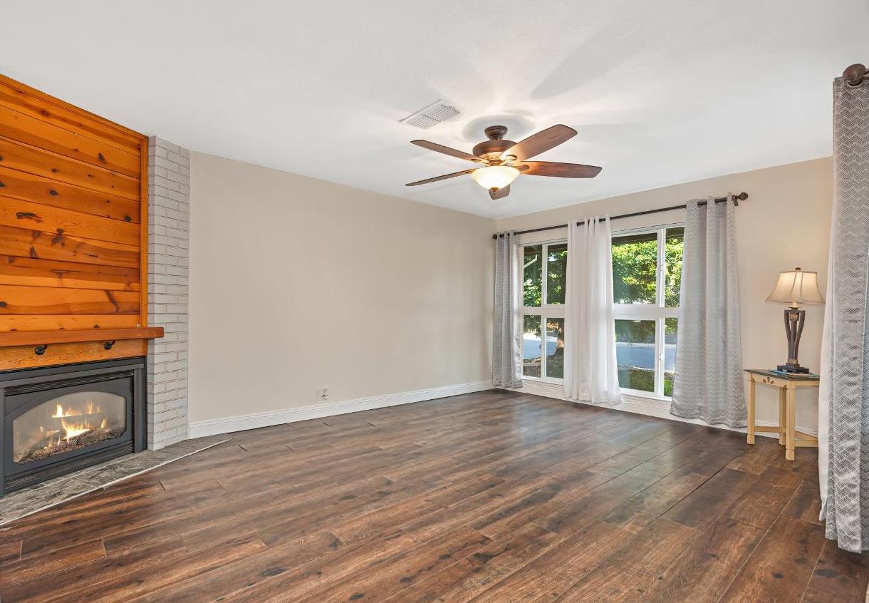 2700 Lassen Way Rocklin, CA 95677 - Photo 6 of 36 a view of an empty room with a window and wooden floor