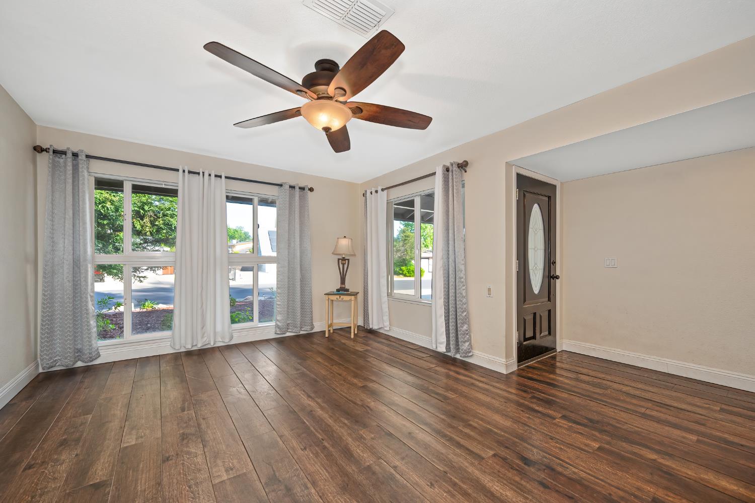 2700 Lassen Way Rocklin, CA 95677 - Photo 7 of 36 a view of an empty room with wooden floor and a window