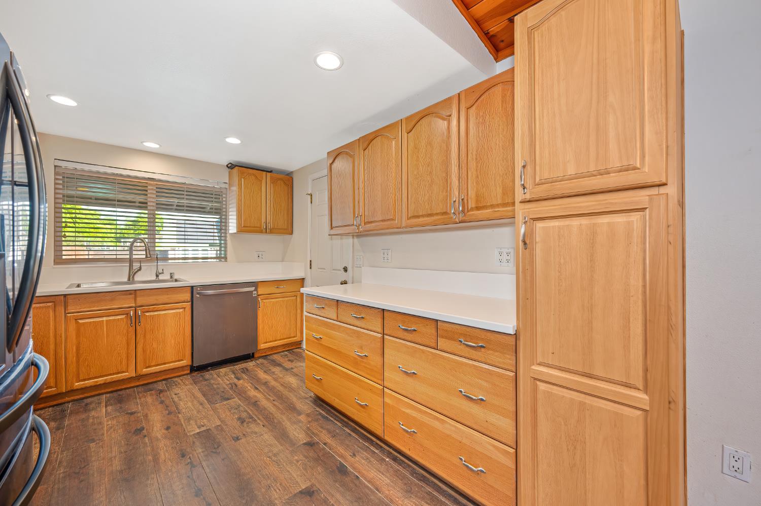 2700 Lassen Way Rocklin, CA 95677 - Photo 9 of 36 a kitchen with stainless steel appliances granite countertop a sink window and cabinets