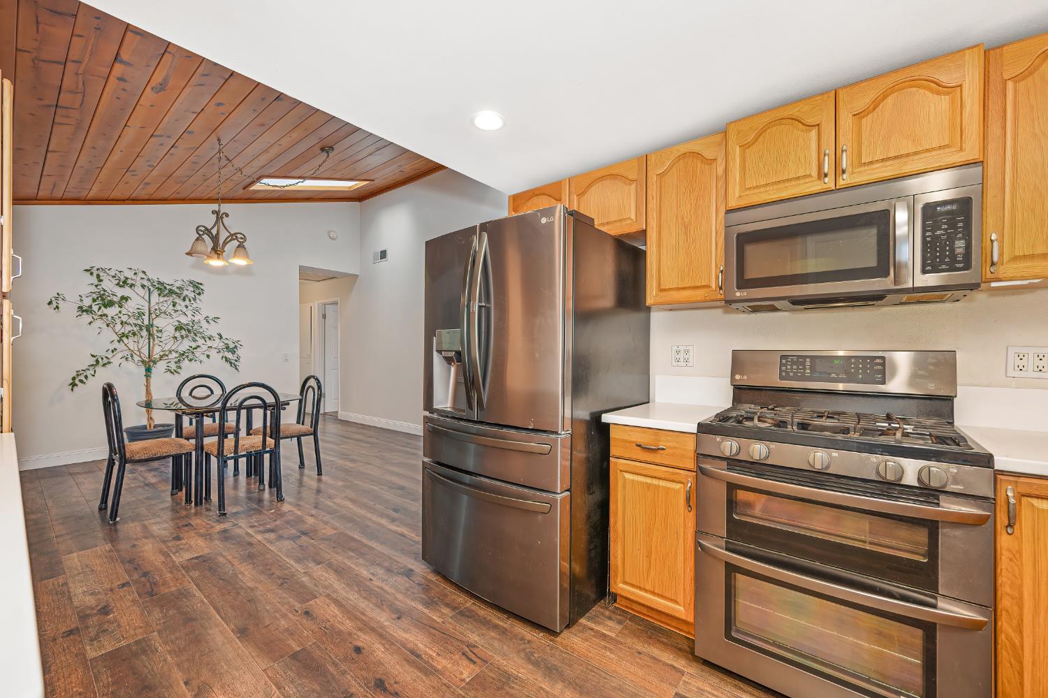 2700 Lassen Way Rocklin, CA 95677 - Photo 10 of 36 a kitchen with stainless steel appliances granite countertop a stove a refrigerator and a microwave