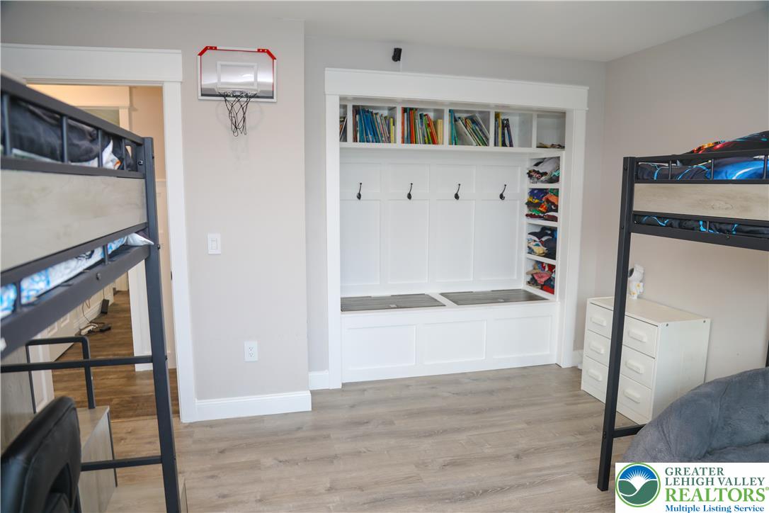 1412 Stanford Road Bethlehem, PA 18018 - Photo 33 of 58 Functional built-in shelving and bench with storage seating maximize space in this well-appointed room.