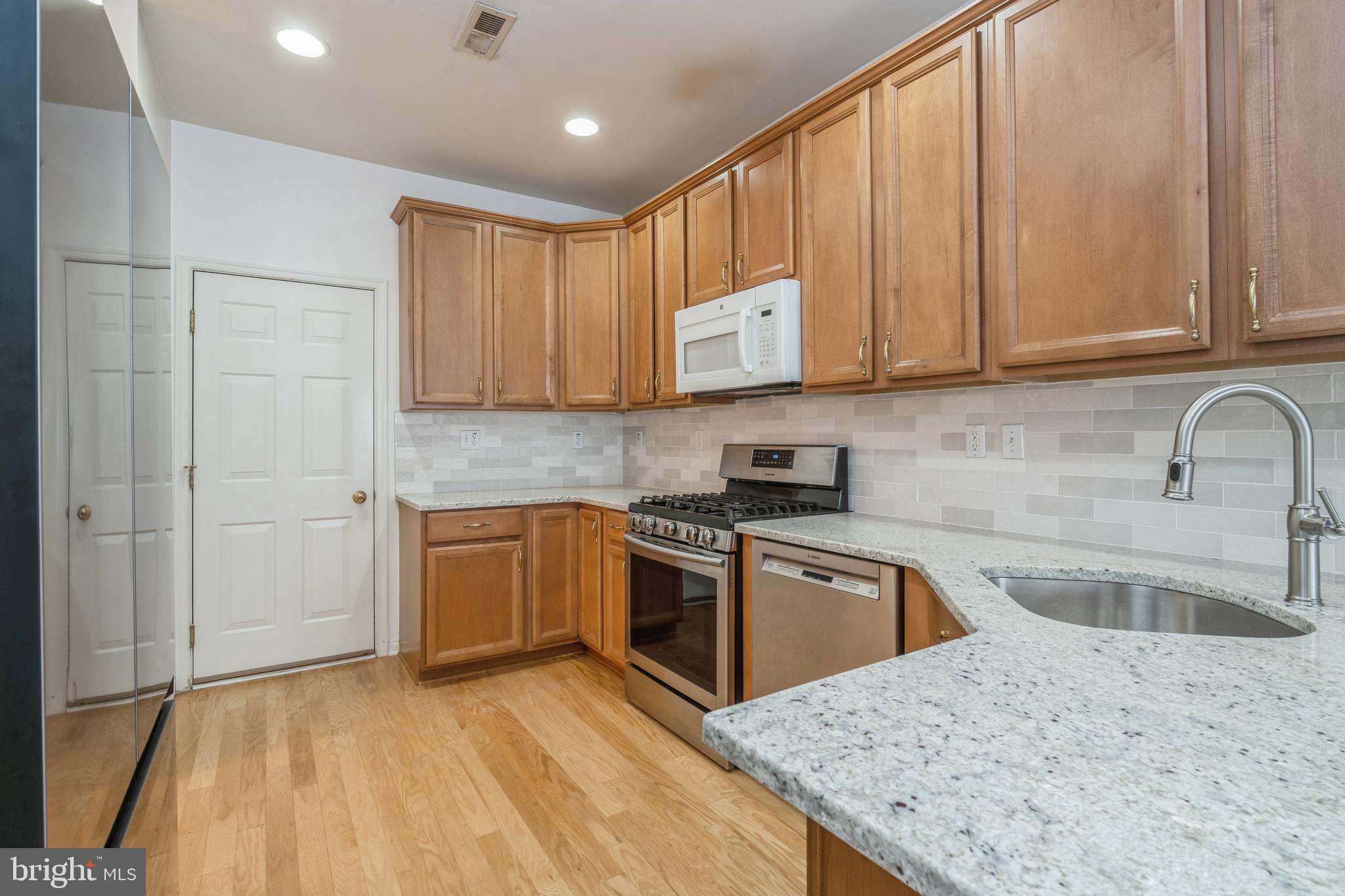 250 Brinley Drive Pennington, NJ 08534 - Photo 13 of 34 a kitchen with stainless steel appliances granite countertop a granite counter tops and a stove top oven