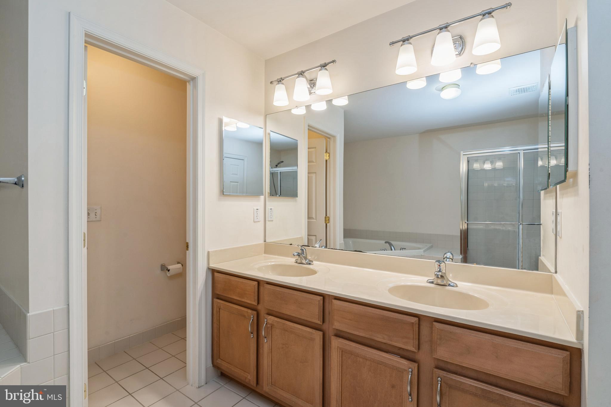 250 Brinley Drive Pennington, NJ 08534 - Photo 24 of 34 a bathroom with a sink double vanity and a mirror