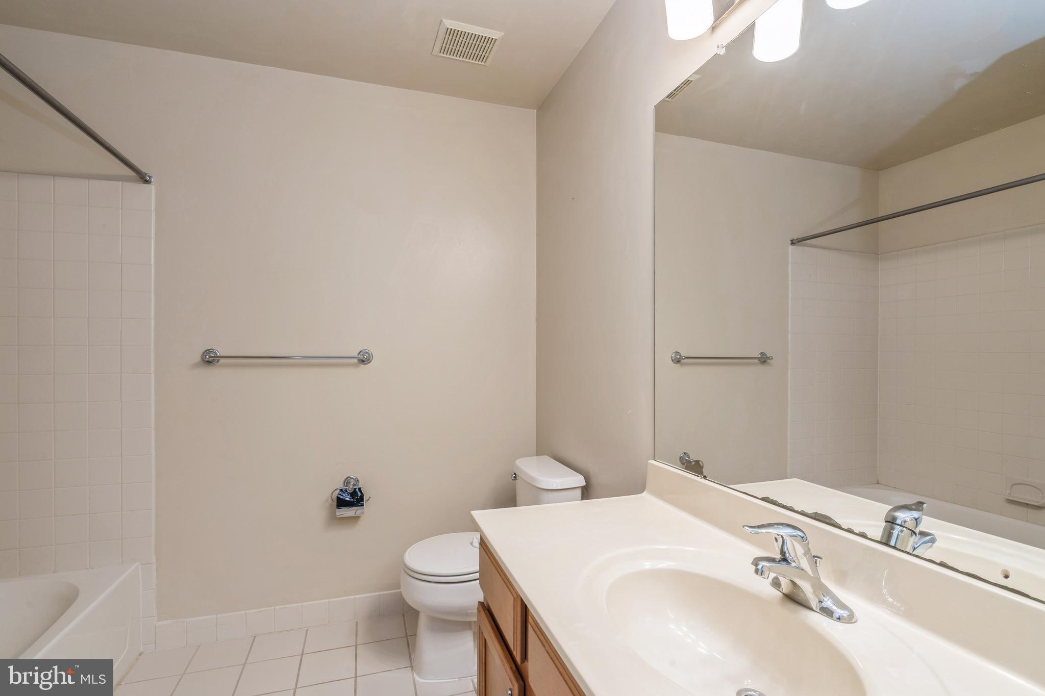 250 Brinley Drive Pennington, NJ 08534 - Photo 29 of 34 a bathroom with a sink toilet and vanity