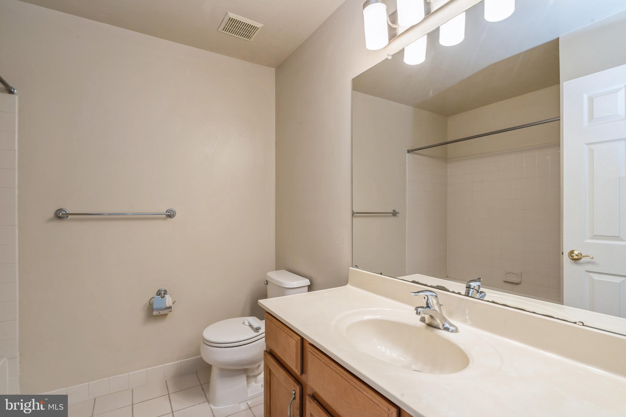 250 Brinley Drive Pennington, NJ 08534 - Photo 30 of 34 a bathroom with a sink toilet and a mirror