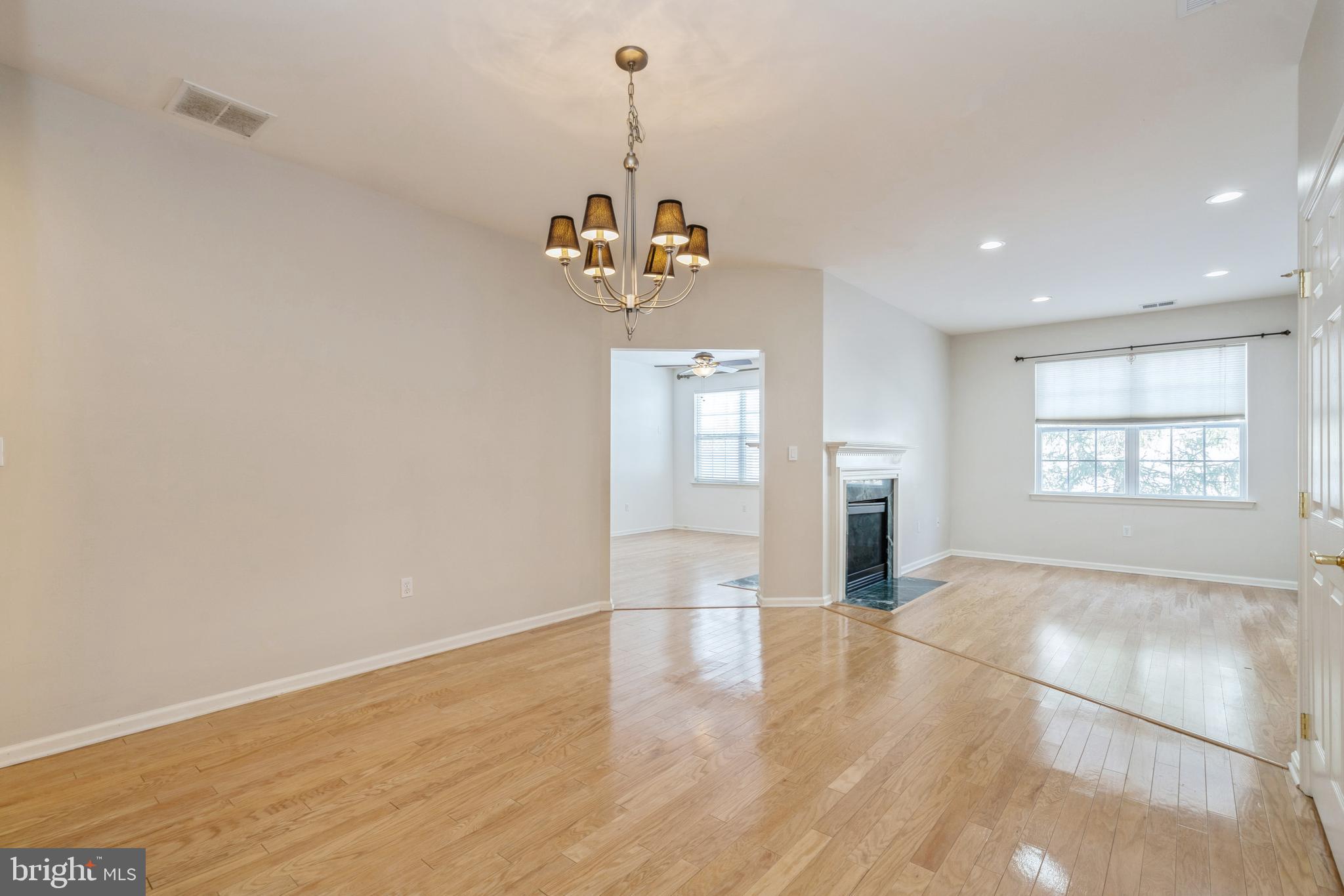 250 Brinley Drive Pennington, NJ 08534 - Photo 4 of 34 a view of a room with wooden floor and windows