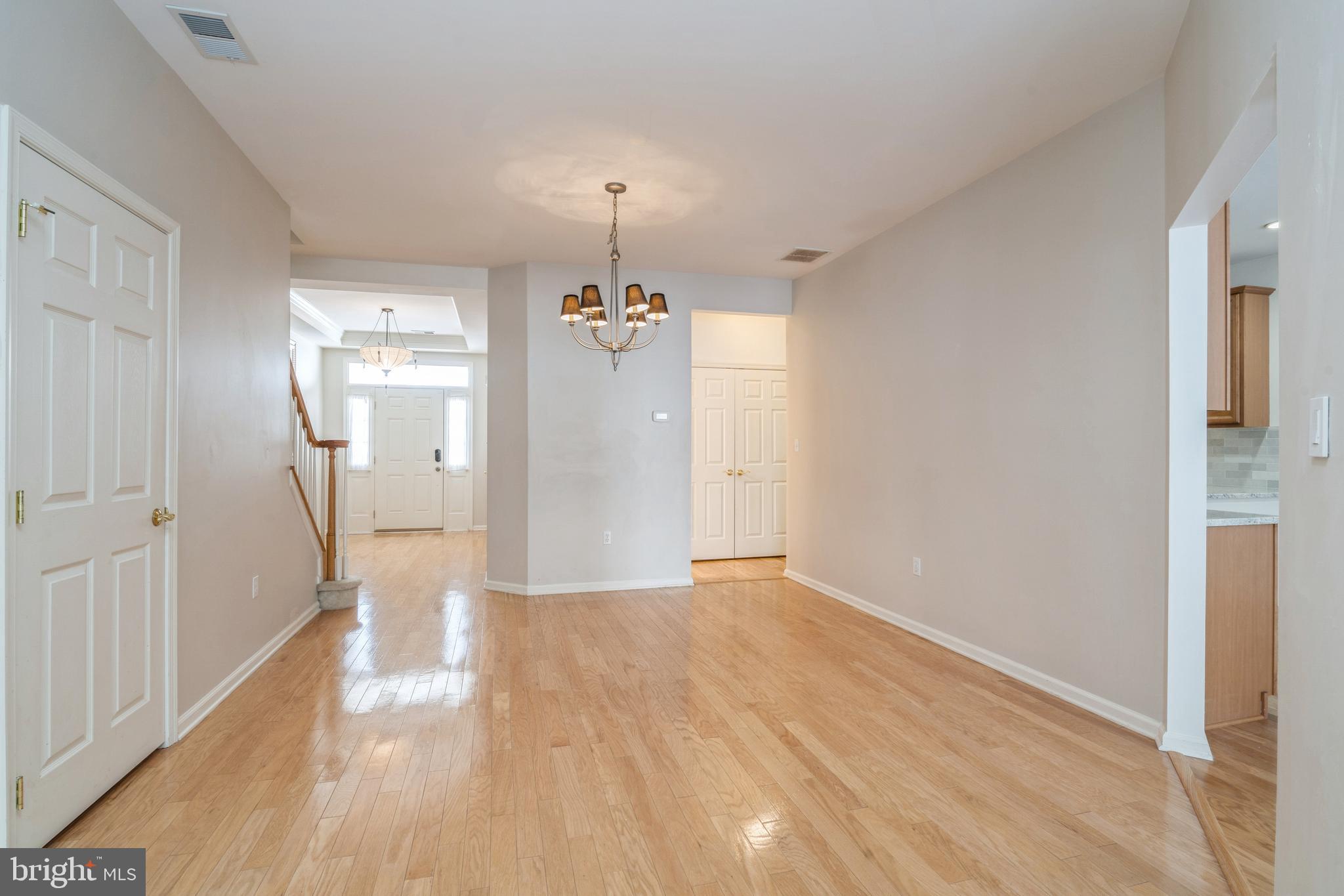 250 Brinley Drive Pennington, NJ 08534 - Photo 5 of 34 a view of empty room with wooden floor