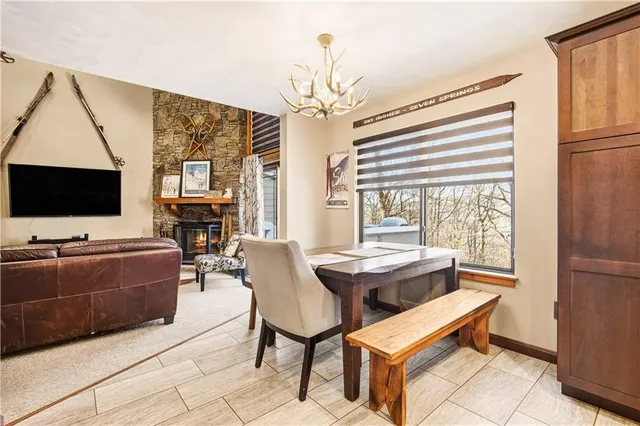 a living room with fireplace furniture and a flat screen tv