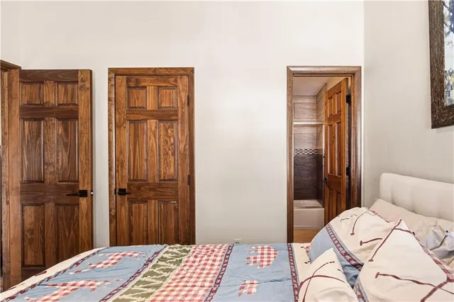 a bedroom with a bed and a dresser