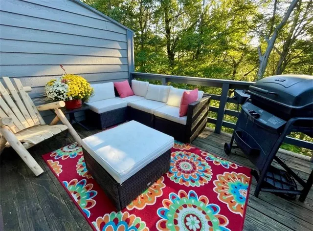 a outdoor living room with furniture and a couch