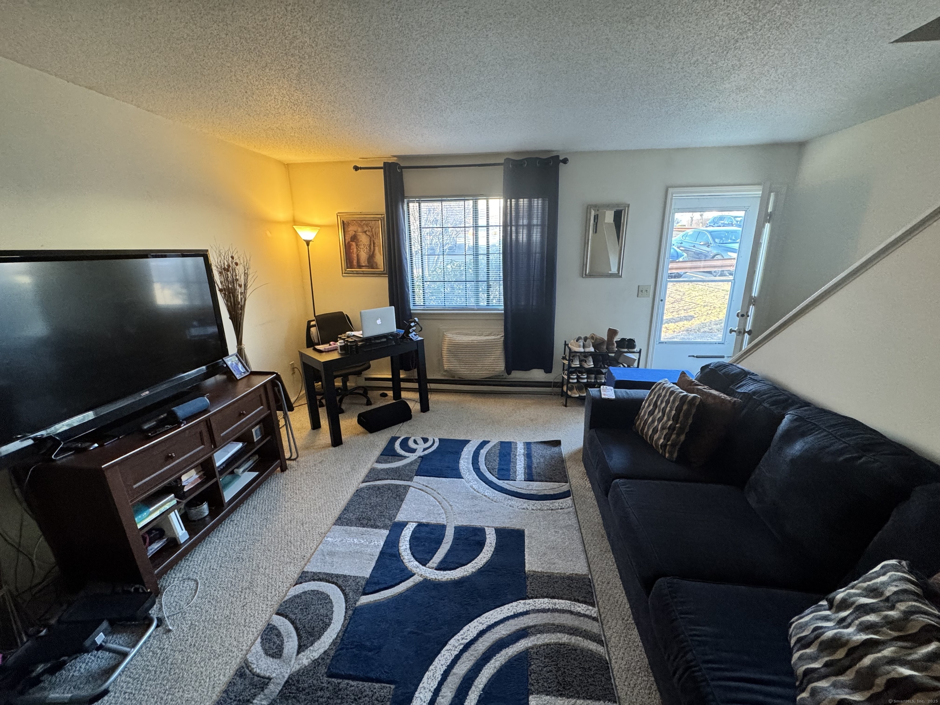499 Scott Road, Unit 13 Waterbury, CT 06705 - Photo 1 of 1 a living room with furniture and a flat screen tv