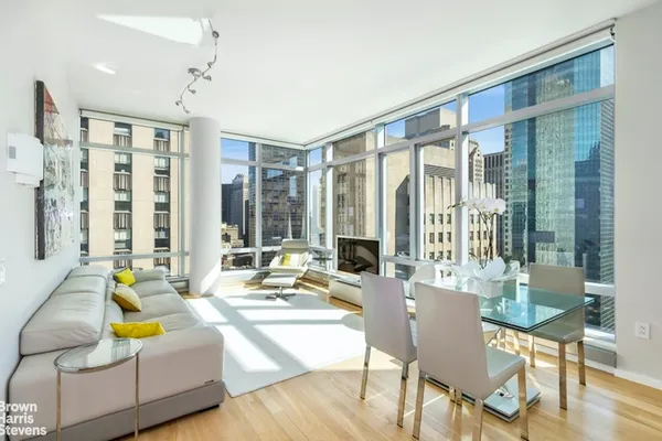 a living room filled with furniture and a table