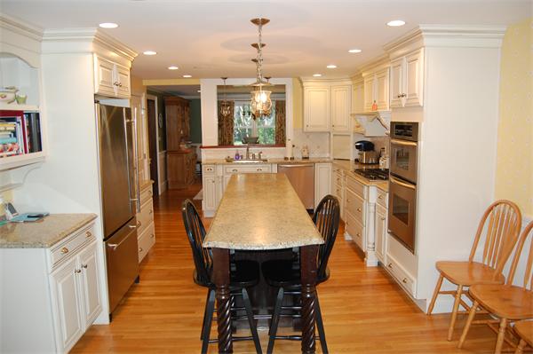692 Boston Post Road Weston, MA 02493 - Photo 6 of 8 a dining room with stainless steel appliances granite countertop furniture wooden floor and a kitchen view