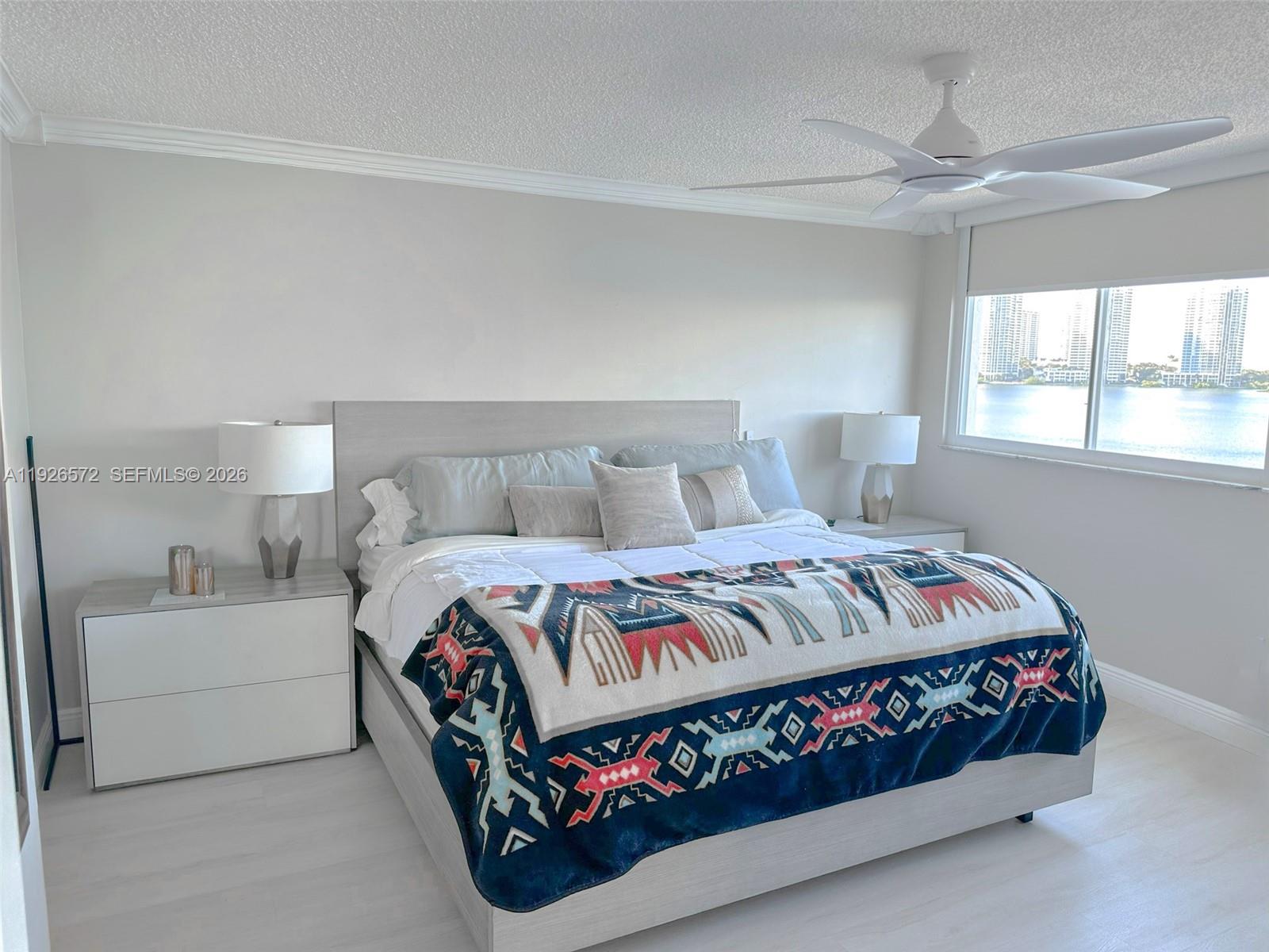 18000 North Bay Road, Unit 603 Sunny Isles Beach, FL 33160 - Photo 17 of 30 a bedroom with a bed and window