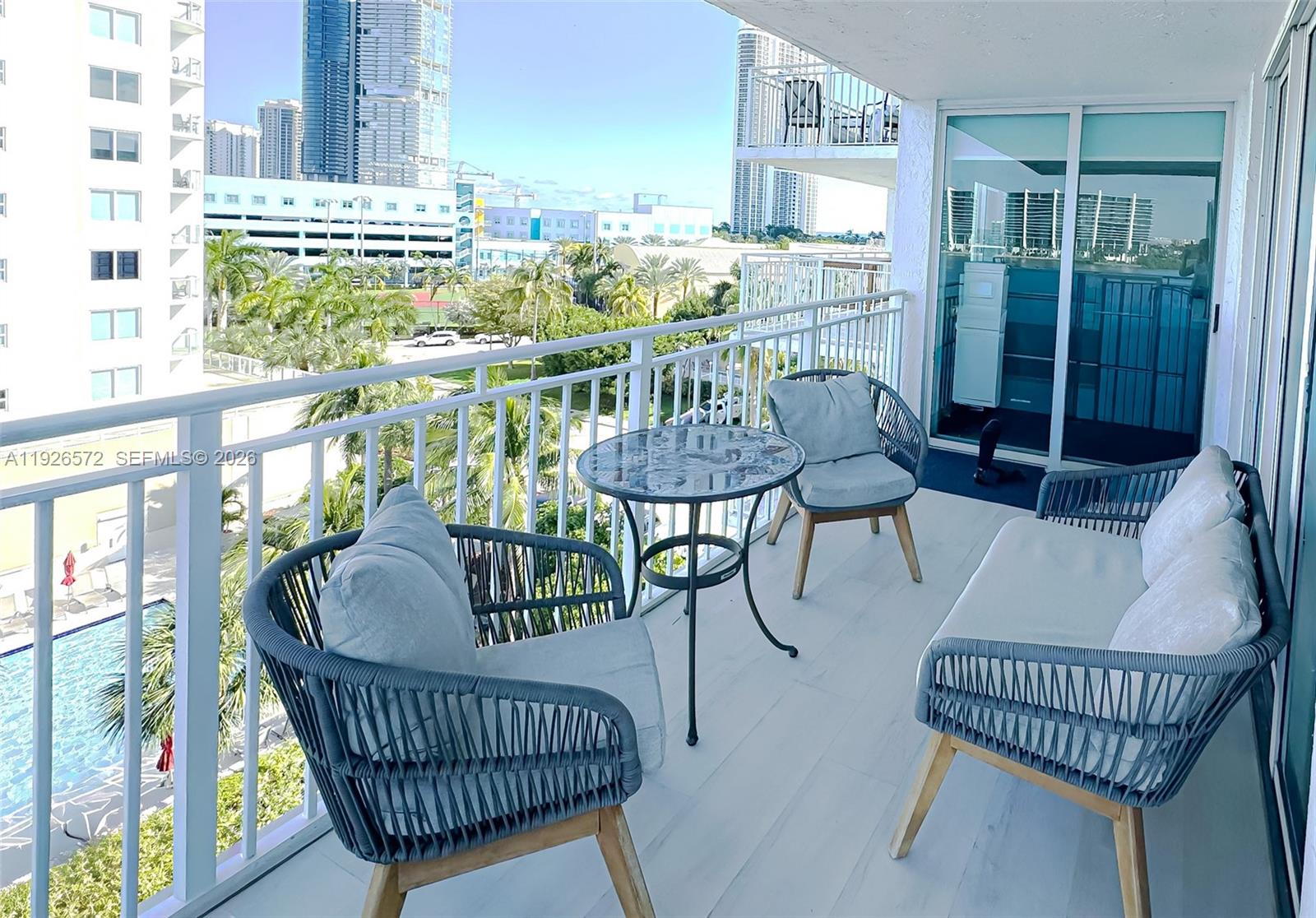 18000 North Bay Road, Unit 603 Sunny Isles Beach, FL 33160 - Photo 10 of 30 a view of a dining room with furniture window and outside view